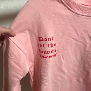 Bright pink Don’t Eat the Homies sweatshirt